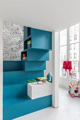 Blue steps in cheerful, colourful child's bedroom