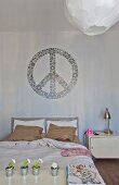 Mural of CND symbol above bed and metal bedside table