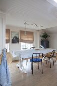 Simple dining room decorated with linen fabrics in natural shades