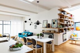 Modern table, Baroque chairs and corner shelving in dining room