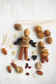 Making fantasy figurines from dried fruits and toothpicks