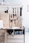 Workbench with tools hung on wooden plate