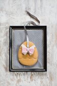 Easter decoration with butterfly motif in vintage picture frame