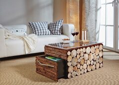 Rustic DIY coffee table clad in bark and slices of log