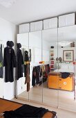 Mirrored wardrobes and storage solutions in small bedroom