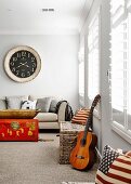 Bright living room with louvre windows and a mix of styles