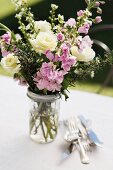 Bouquet of summer flowers decorating garden table