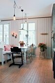 High chair and old bench in vintage-style dining area