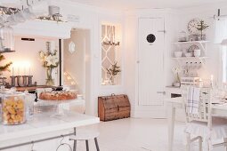 Dining table in festively decorated country-house kitchen