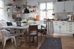 Rustic dining table in white, country-house-style kitchen-dining room
