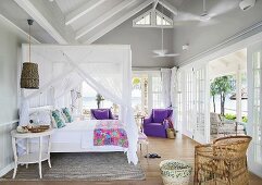 Canopy bed in bedroom of summery beach house