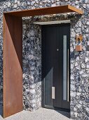 Modern entrance to house with corten steel porch