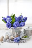 Blue hyacinths in silver jelly mould surrounded by egg shells