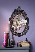 Black picture frame decorated with spider-web arrangement for Halloween