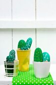 Small cacti garden made from painted pebbles