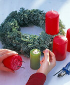 Advent wreath with ilex and apples