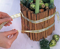 Christmas wreath with glass and cinnamon sticks (green candles)