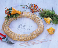 Wreath with ornamental pumpkins and rosehips -
