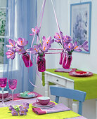 Hanging table top in pink bottles