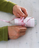 Bottle in napkin as a minivase