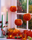 Pumpkins as lanterns in the window