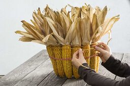 Bucket decorated with corncobs