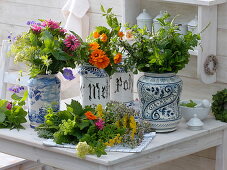 Herbal bouquet in old ceramic teapots