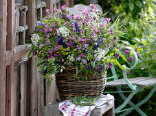 Meadow bouquet in basket vase