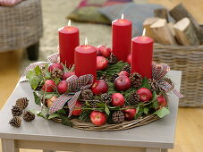 Natural Advent wreath with apples, cones, hedera