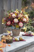 Autumn bouquet with Rose, cotoneaster with berries
