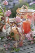 Large canning jars as lanterns with pinks (roses)