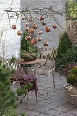 Christmas terrace with copper balls on the branch