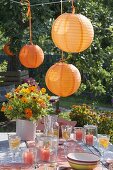 Garden party with orange lanterns as decoration