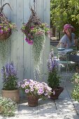 Terrace with homemade flower baskets and willow pots