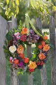 Autumnal wreath at the fence