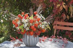 Autumn bouquet with physalis, aster, miscanthus