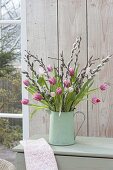 Bouquet of Tulipa (tulip) and twigs of Salix (kitten's willow)