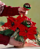 Tying a Christmas bouquet