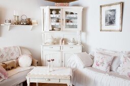 Shabby-chic sofa and dresser in living room
