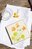 Coaster painted with floral motif