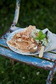 Pancakes filled with apple sauce on vintage-style plate