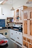 Stripped wooden cabinet in country-house kitchen