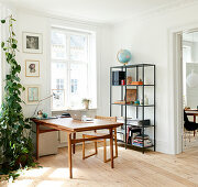 Desk, chair and simple shelves in study