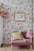 Pink couch against floral wallpaper in child's bedroom