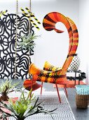 Artistically curved outdoor easy chair with ethnic striped pattern