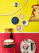 Colourful accessories in front of two-tone wall
