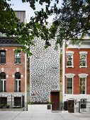 Modern façade made from perforated sheet steel between town houses