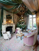 Open fireplace and festive drapery in classic lounge