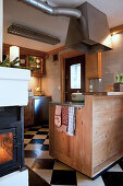 Cosy country-house kitchen with chequered floor