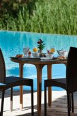 Set breakfast table next to swimming pool